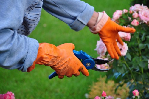 Worker moving materials safely in formal gardens