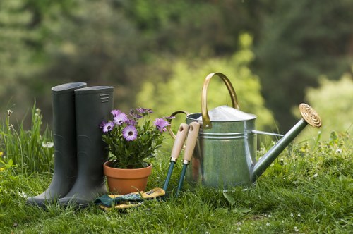 Landscape gardening in Manor House with a stylish patio and layered planting