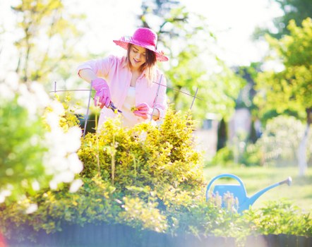 Professional gardeners shaping borders in a historic garden